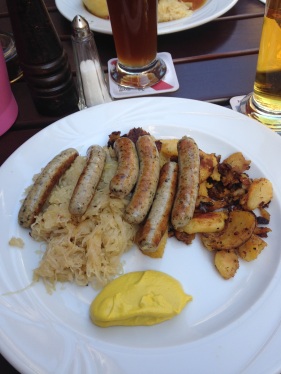 Sausages, sauerkraut, and potato hash.
